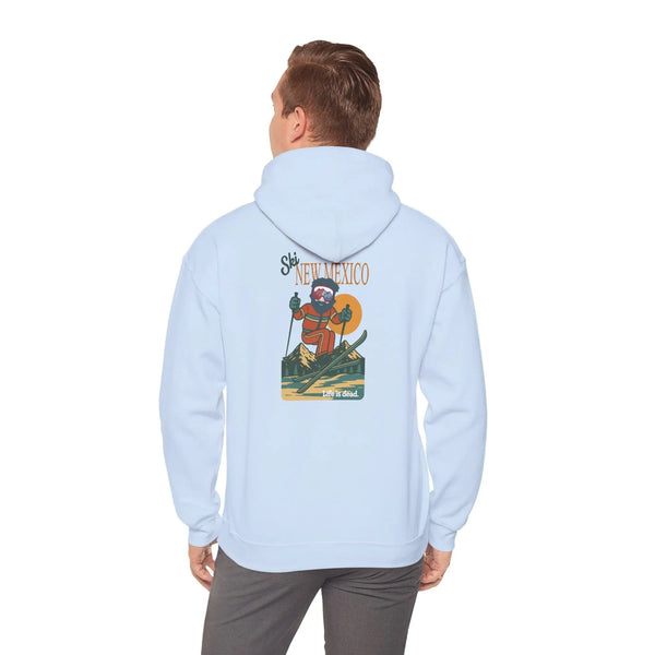 Light blue ski-themed hoodie with back graphic; hood and long sleeves