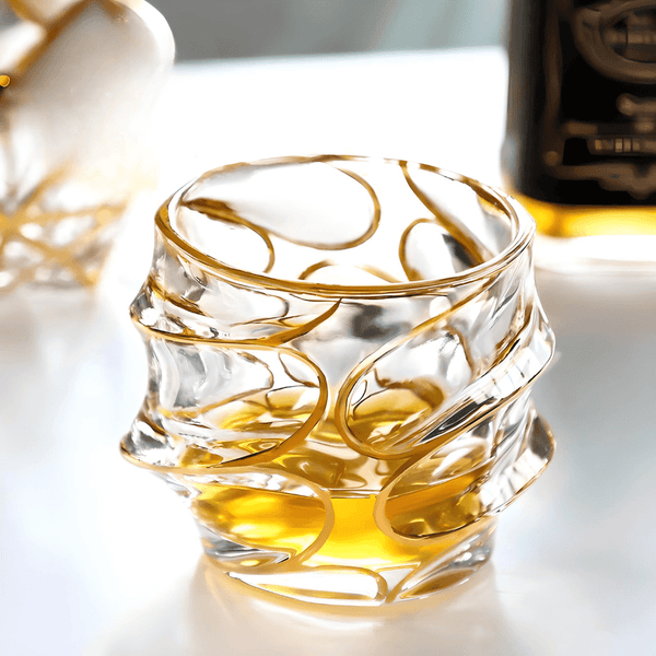 Japanese crystal whisky glass with gold line swirl pattern, clear body