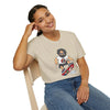 Light cream crewneck T-shirt with cartoon skateboarding graphic on chest.
