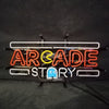 Neon sign “ARCADE STORY” with white tubing frame, orange letters, blue ghost front.