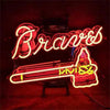 Neon Braves sign with Braves script and tomahawk figure beside baseball bat, red glow