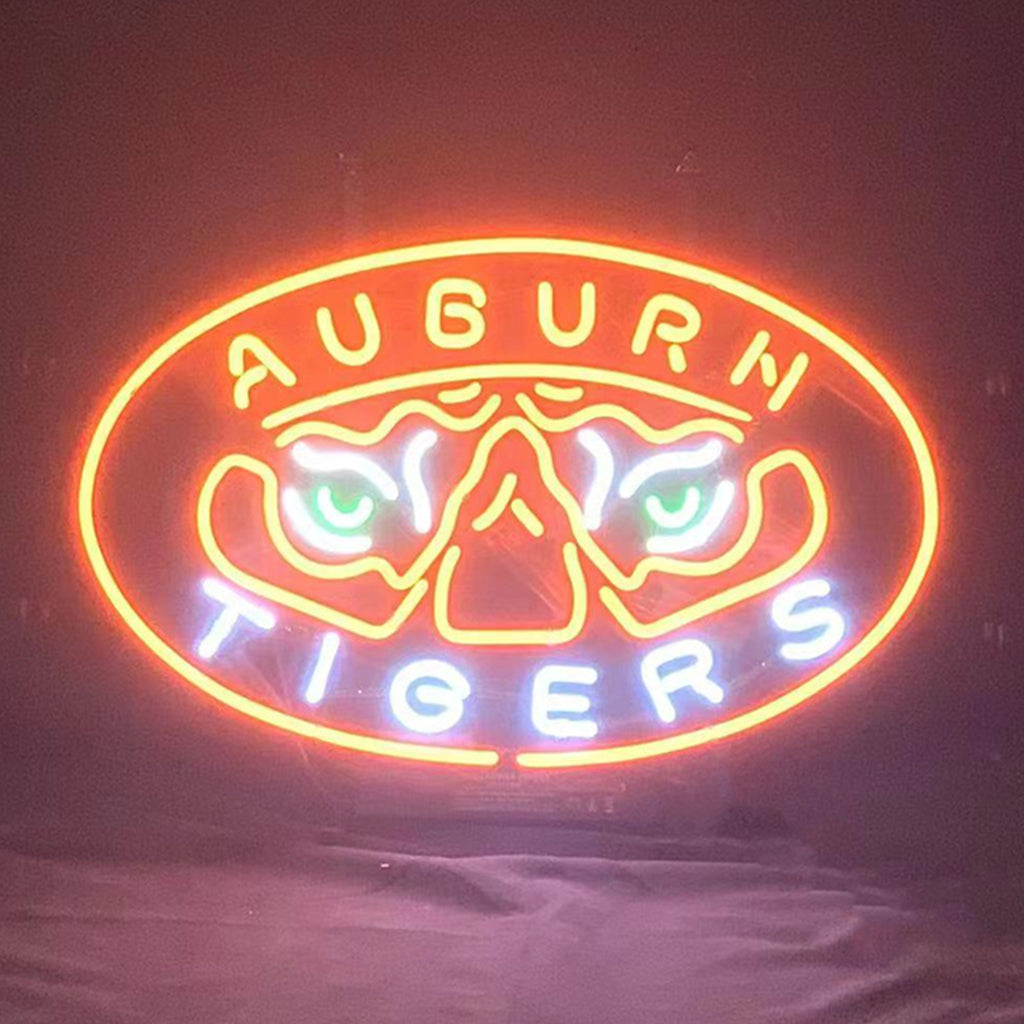 Neon oval sign showing Auburn tiger logo and 'AUBURN TIGERS' text, orange glow
