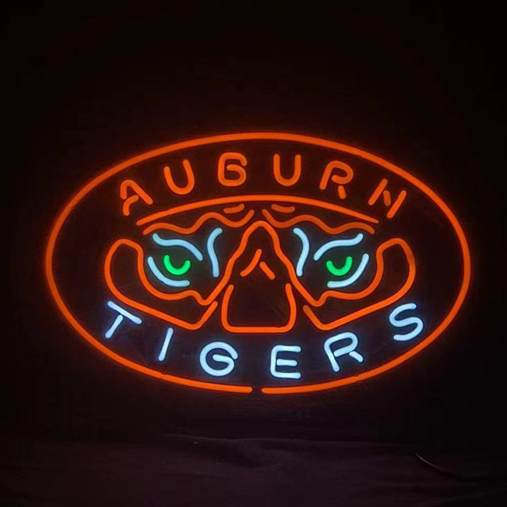 Neon oval tiger sign with Auburn text, orange border and blue-green eye lights