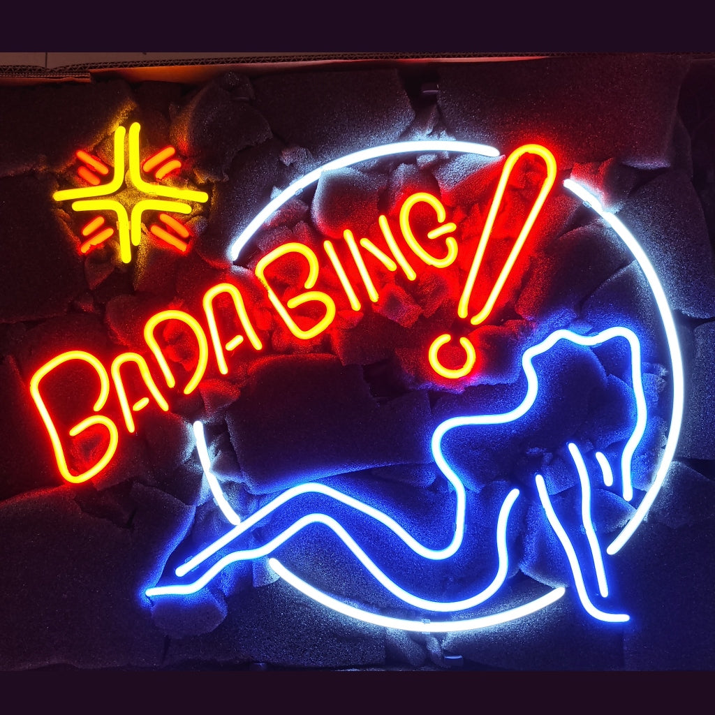 Neon Bada Bing sign with cocktail glass and blue legs, red, yellow, white, blue light