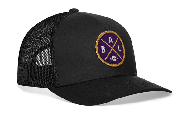 Black trucker snapback hat with BALX logo patch on front and mesh side panels