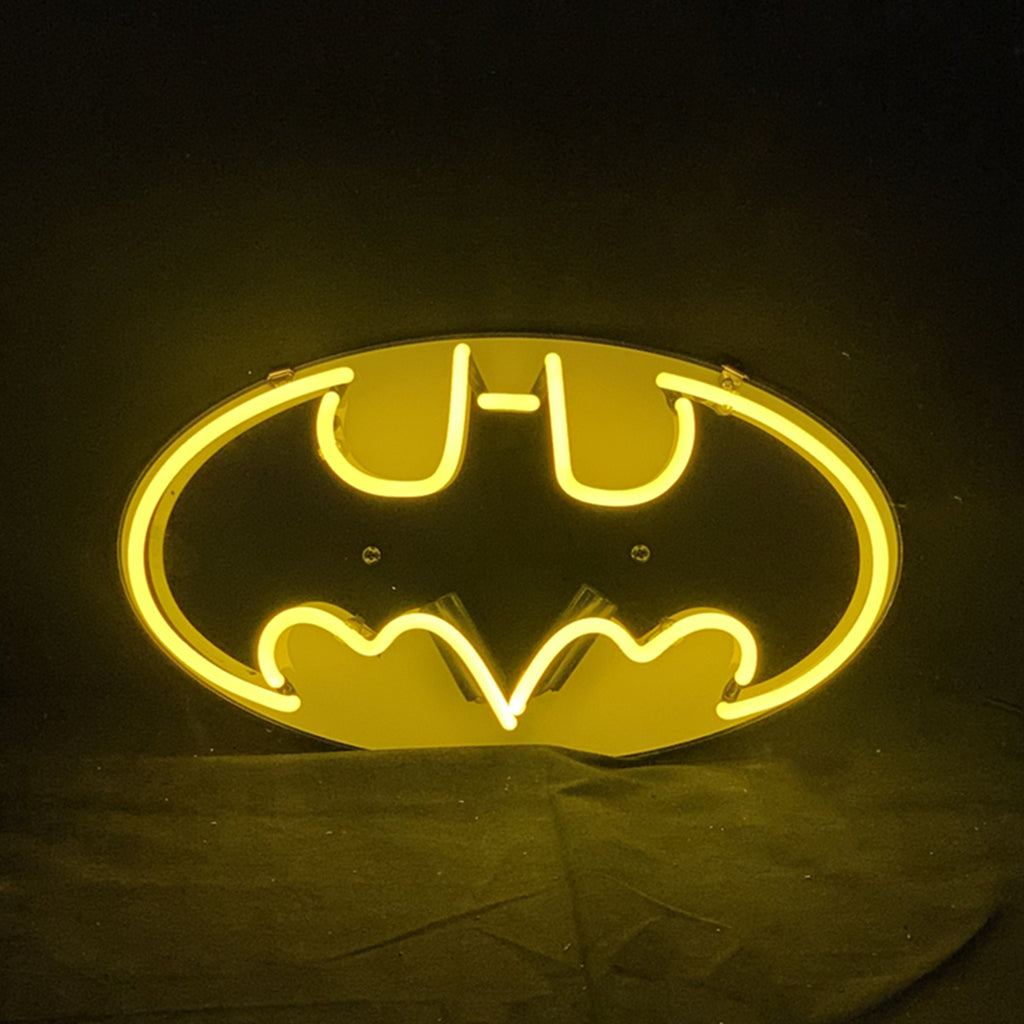 Neon bat logo sign with glowing yellow oval outline