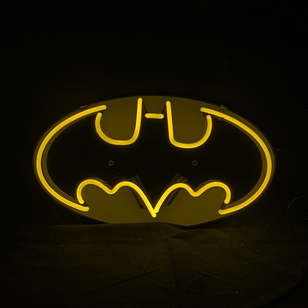 Neon bat logo sign, yellow glow inside oval frame