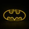 Neon bat logo sign, yellow glow inside oval frame
