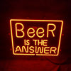 Neon light sign with “Beer is the answer” text in bright orange glow