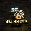 Neon Toucan bird and GUINNESS wall sign mounted on a brick wall
