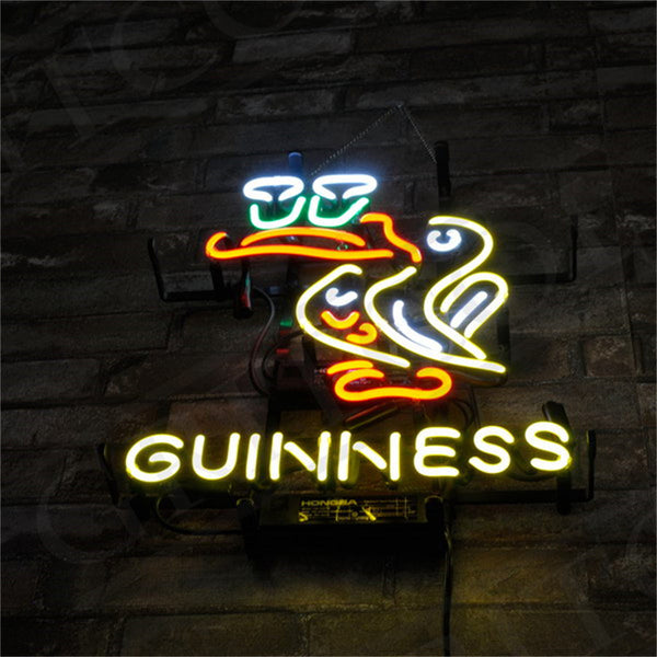 Neon Toucan bird and GUINNESS wall sign mounted on a brick wall