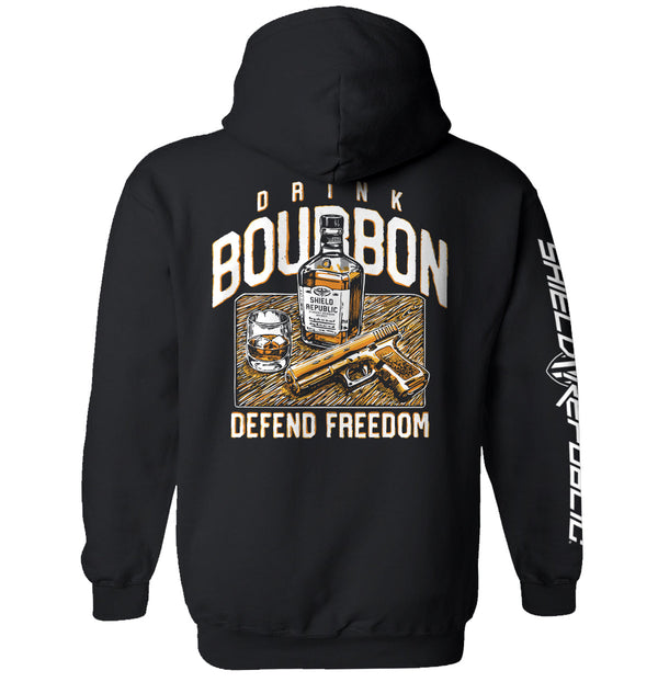 Black hoodie with back graphic: bourbon bottle, DRINK/BOURBON text, DEFEND FREEDOM