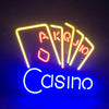 Neon poker sign with fanned yellow cards and blue “Cisino” lettering