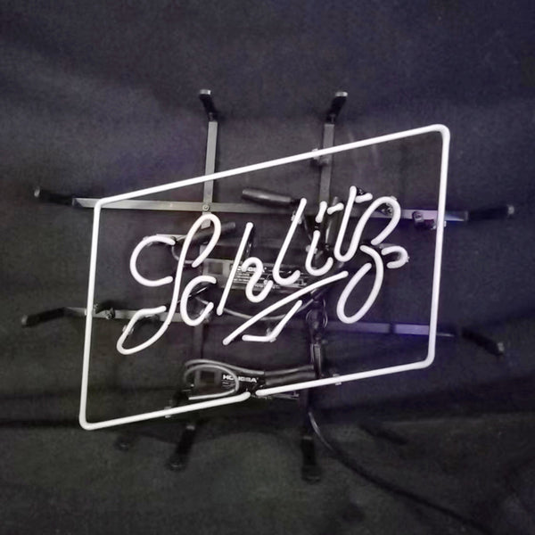 Beer Schlitz neon light sign with white border, Schlitz script on metal frame and stand