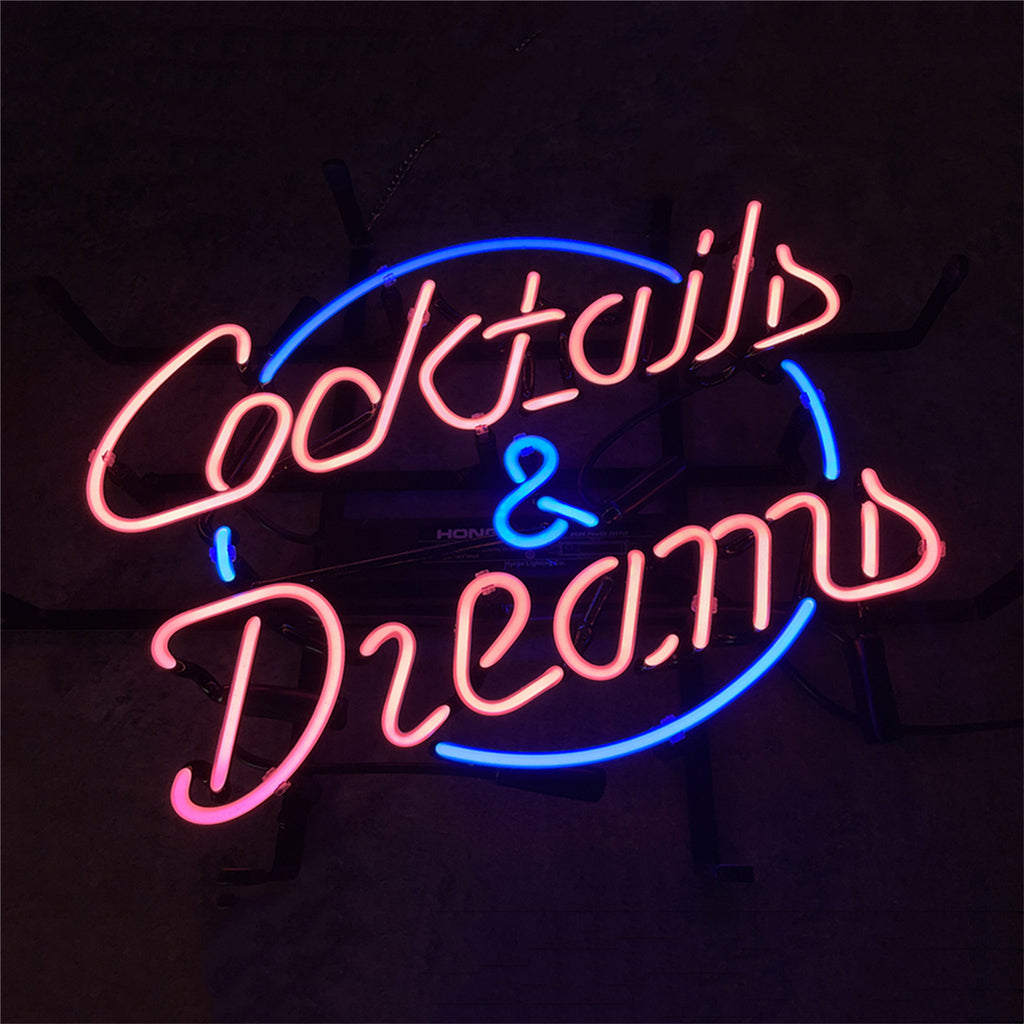 Neon cocktail and dreams sign with blue, pink, and purple glowing cursive