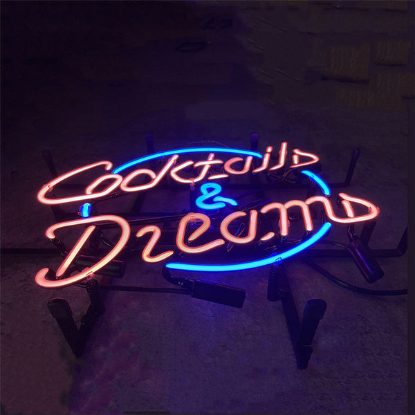 Neon cocktail and dreams wall sign with pink and blue glowing letters