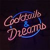 Neon cocktail and dreams sign with blue, pink, and purple glowing cursive