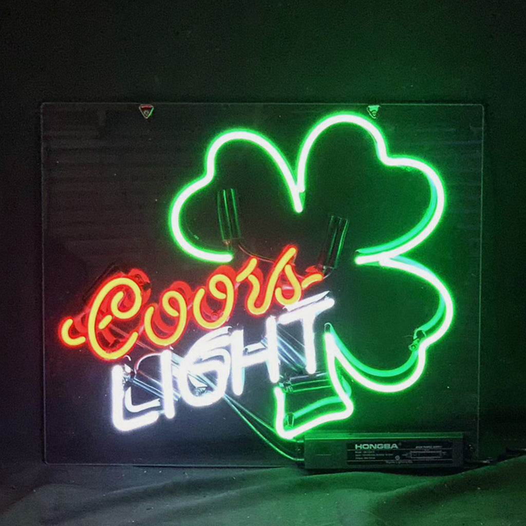 Neon clover light sign with green outline and red script, blue and white lettering
