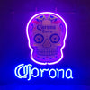 Neon skull beer sign reading Corona Extra, glowing purple and blue