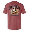 Rust-red T-shirt with back graphic: bourbon bottle, DRINK/BOURBON text, DEFEND FREEDOM