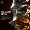 Faceted crystal whisky glass close-up with amber highlights