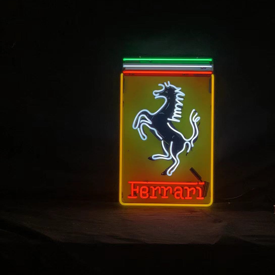 Front-facing rectangular neon sign: prancing horse and Ferrari wordmark, red and green glow