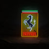Front-facing rectangular neon sign: prancing horse and Ferrari wordmark, red and green glow