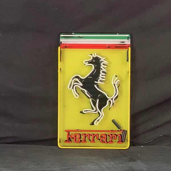 Rectangular Ferrari neon logo sign with prancing horse and Ferrari wordmark, on stand