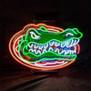 Neon alligator face sign, green face with blue teeth and orange outer ring, white outline