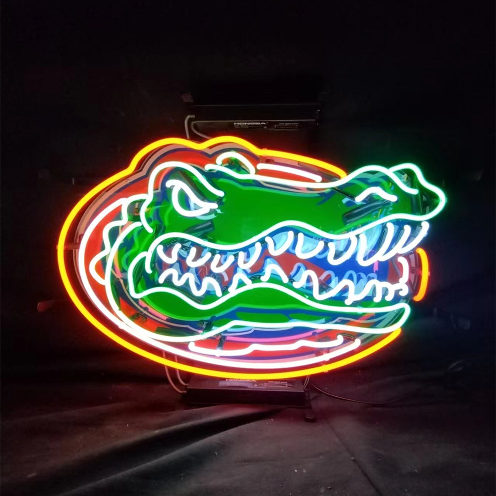 Neon alligator face sign, green with blue and orange glow accents, white outline