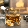 Close-up whisky glass with gold rim holding amber liquid