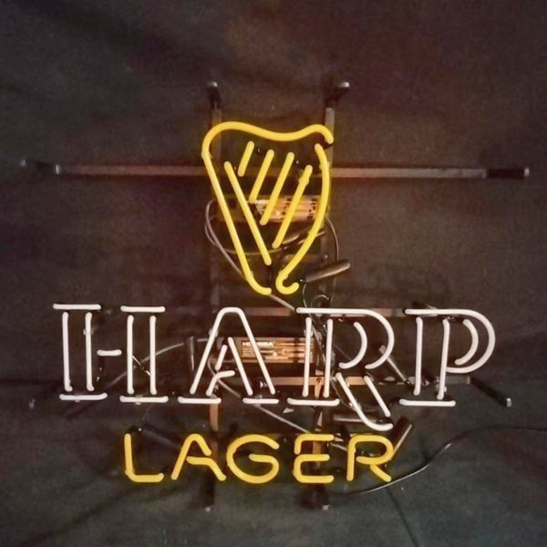 Harp Lager beer neon sign with yellow harp icon and 'HARP'/'LAGER' lettering