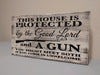 MINI "THIS HOUSE IS PROTECTED" GUN CONCEALMENT WALL ART