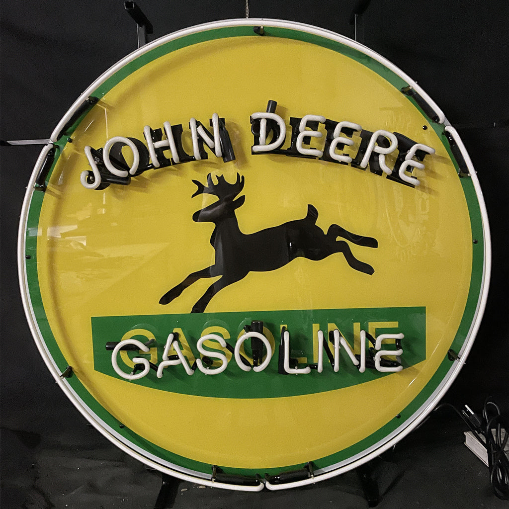 John Deere Gasoline neon sign, circular green light ring with horse silhouette and text.