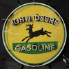 John Deere Gasoline neon sign, circular green light ring with horse silhouette and text.