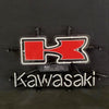 Kawasaki Beer neon sign with blue-outlined red logo and Kawasaki script text