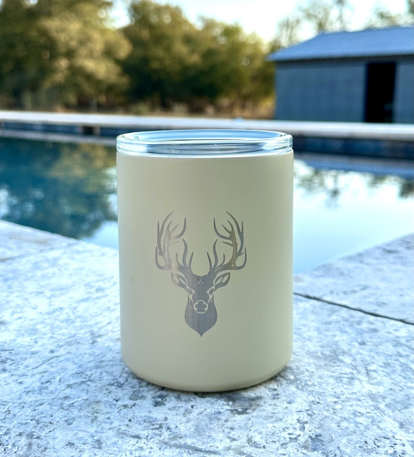 Light khaki insulated whiskey tumbler with deer emblem
