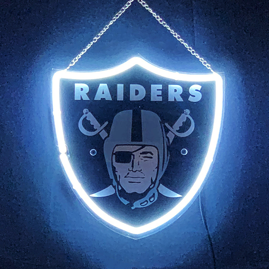 Neon Raiders shield acrylic sign with chain, glowing outline and face graphic