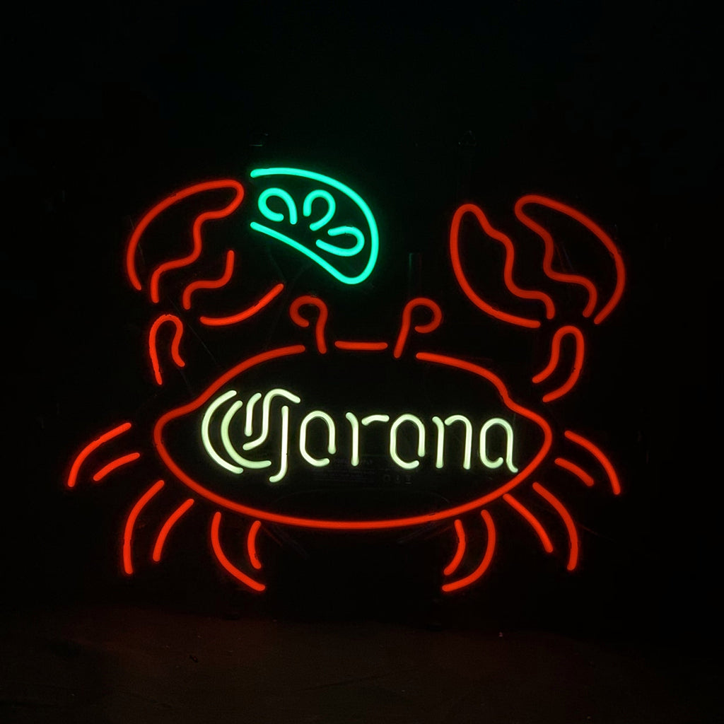 Neon crab light sign with Corona lettering, red outline and green center glow