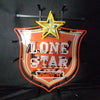 Mounted neon beer sign with yellow star over 'LONE STAR' on red shield, 'BEER' label