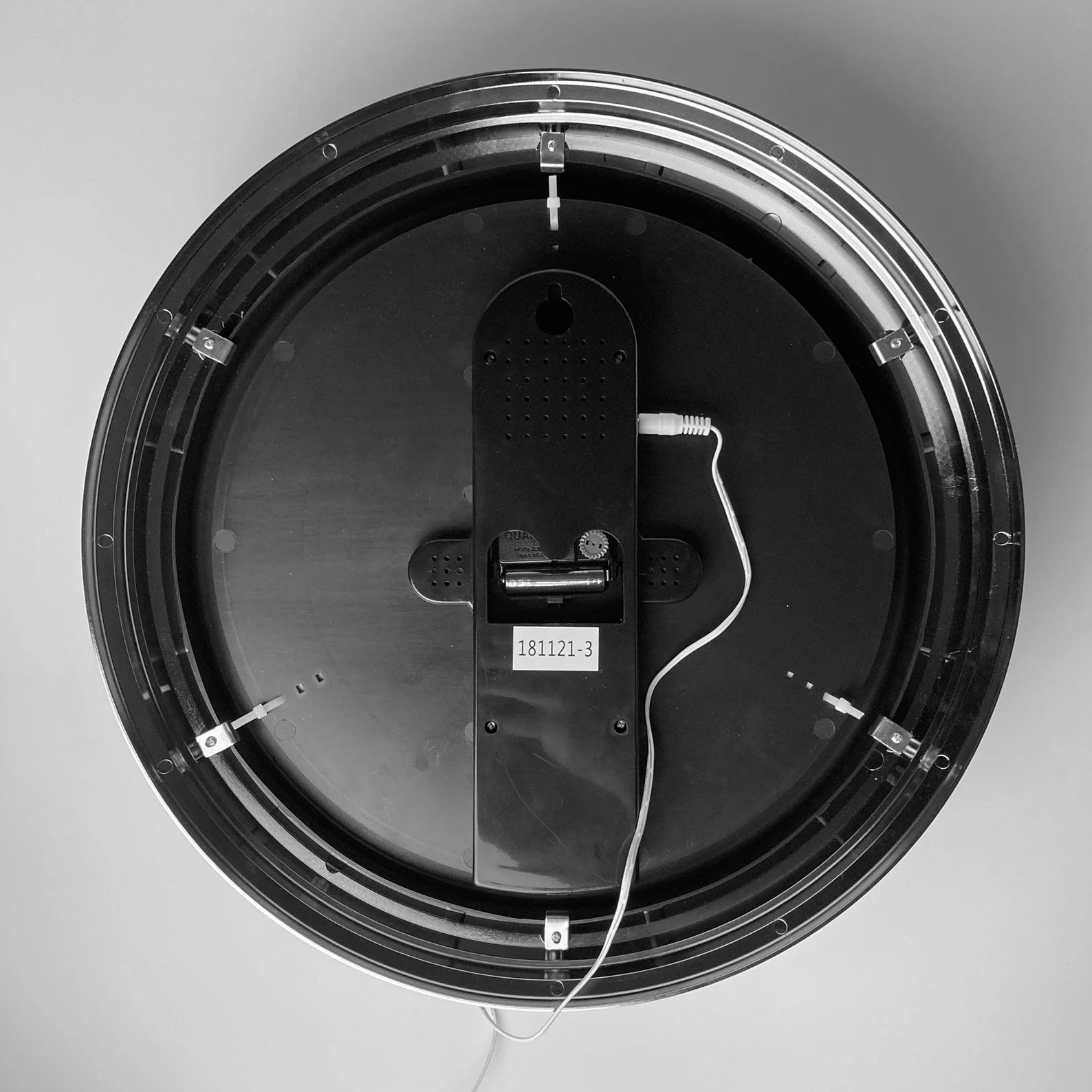 Neon wall clock back plate with mounting hole and visible wiring inside