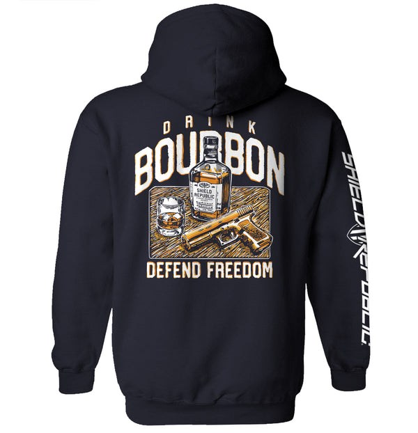 Navy hoodie with back graphic: bourbon bottle, DRINK/BOURBON text, DEFEND FREEDOM