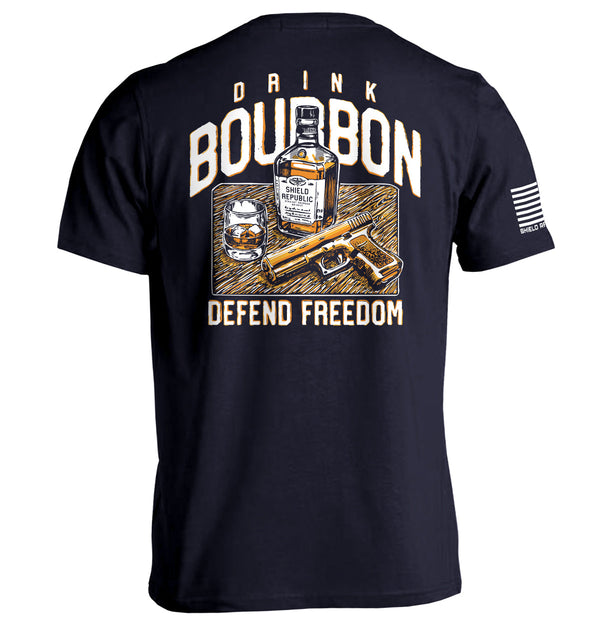 Dark navy T-shirt with back graphic: bourbon bottle, DRINK/BOURBON text, DEFEND FREEDOM