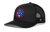 Black trucker snapback hat with round logo patch and mesh side panels