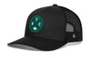 Black trucker snapback hat with green NYC patch and mesh side panels, H logo