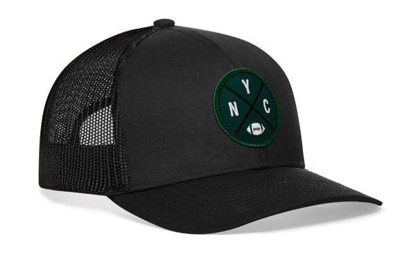 Black trucker snapback hat with green NYC patch and front logo, mesh back panels