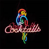 Hanging neon sign showing colorful parrot above cursive 'Cocktails' wording