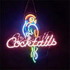 Neon cocktails sign with hanging chain and colorful parrot graphic above cursive 'Cocktails'