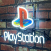 PlayStation neon sign with PS logo and PlayStation text, hanging chains and mount