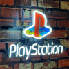 PlayStation neon sign with PS logo and PlayStation text, on black mounting frame